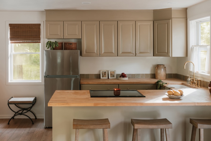 A boot room and pantry in painted cupboards with a solid oak worktop